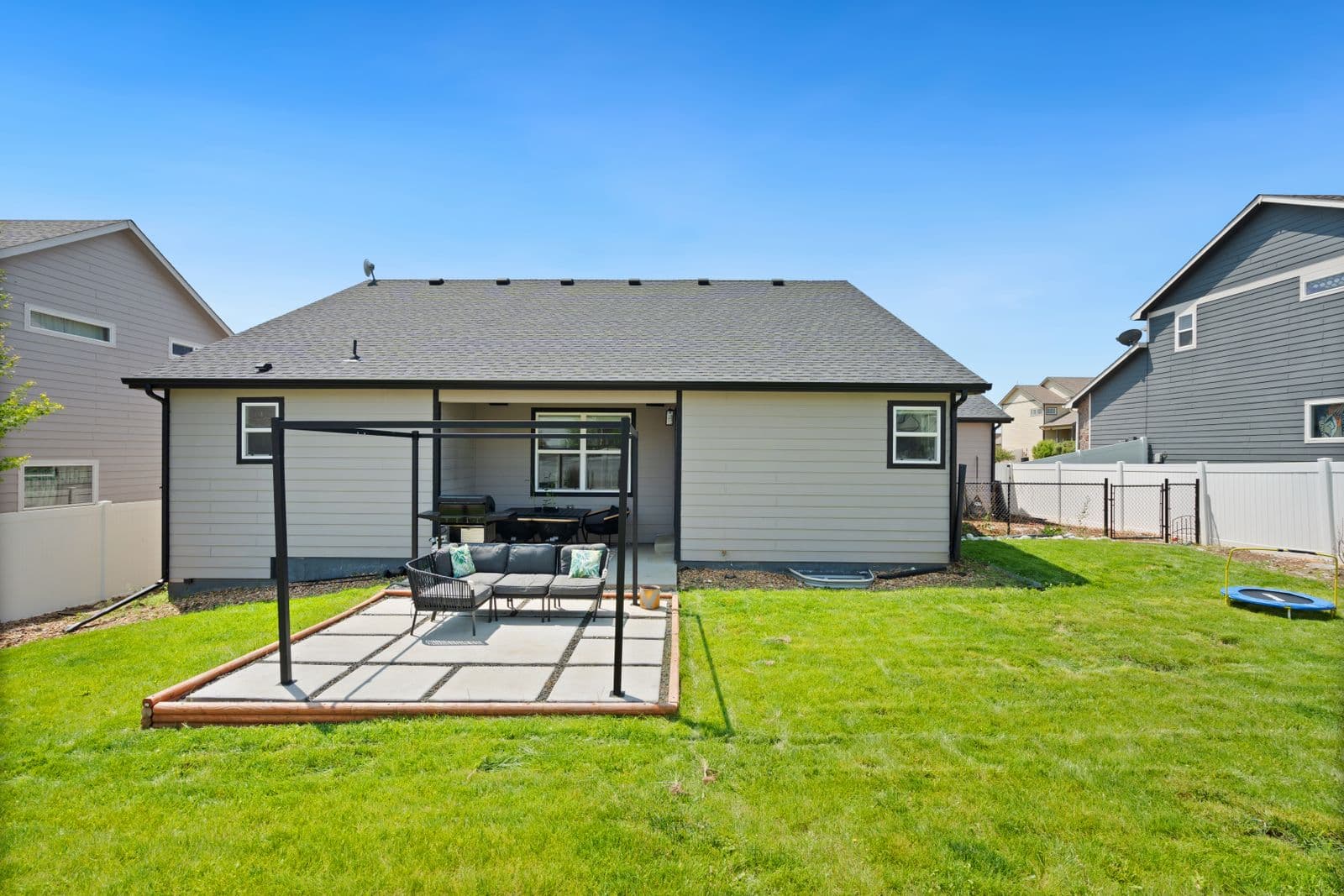Backyard paver patio with pergola